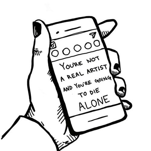 hand holding phone - you're not a real artist and you're going to die alone.